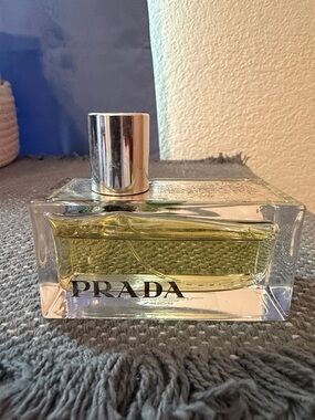 Prada Clear Glass Bottle with Silver Cap and Yellow Liquid Amber